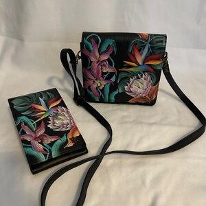 Anuschka Black Crossbody Bag with Vibrant Floral Design